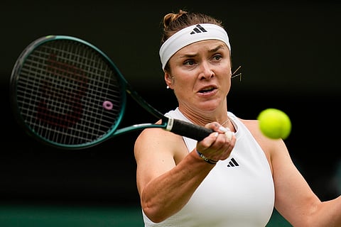 Elina Svitolina returns the ball to Elena Rybakina